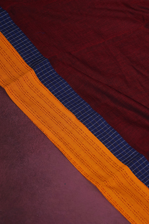H.O.T curated - The maroon mull cotton with chettinad cotton pallu and Kantha border .